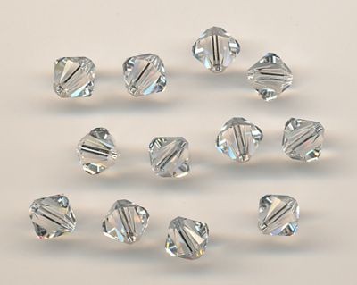 530106134 Swarovski Perlen 6mm crystal 12 Stück